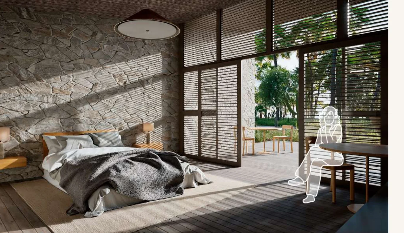 Quartos Autônomos — interior do bangalô com cama, paredes de pedra e vista para o verde